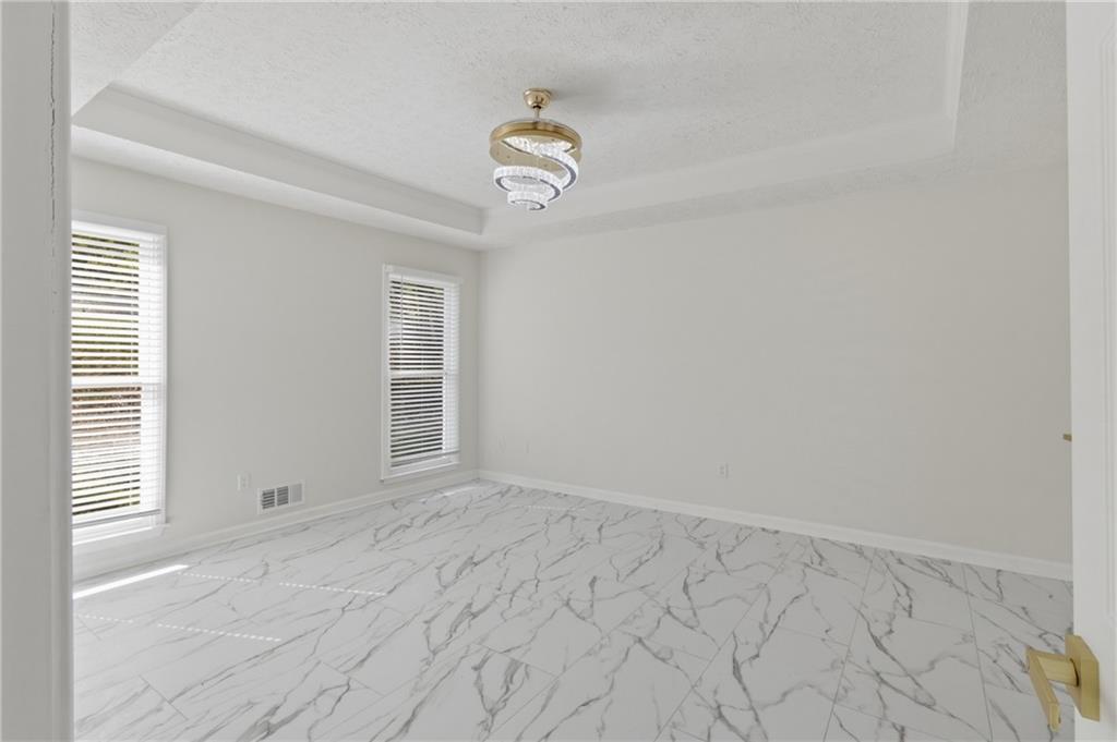 3760 Mountain Cove Road Snellville, GA 30039 - Photo 10 of 73 a view of an empty room with a window and closet