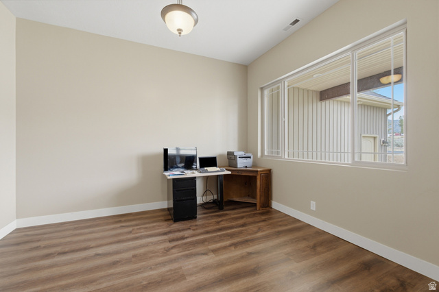 2567 West Rim Rock Drive Stockton, UT 84071 - Photo 20 of 64 Interior room featuring wood-finish flooring, neutral wall tones, and white baseboards