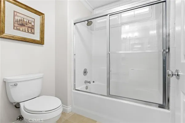 a bathroom with a shower and a toilet