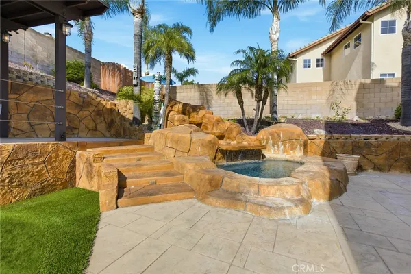a view of a swimming pool with a patio