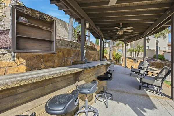 a view of a house with lounge chair and a patio