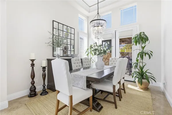 a view of a dining room with furniture window and flowerpot