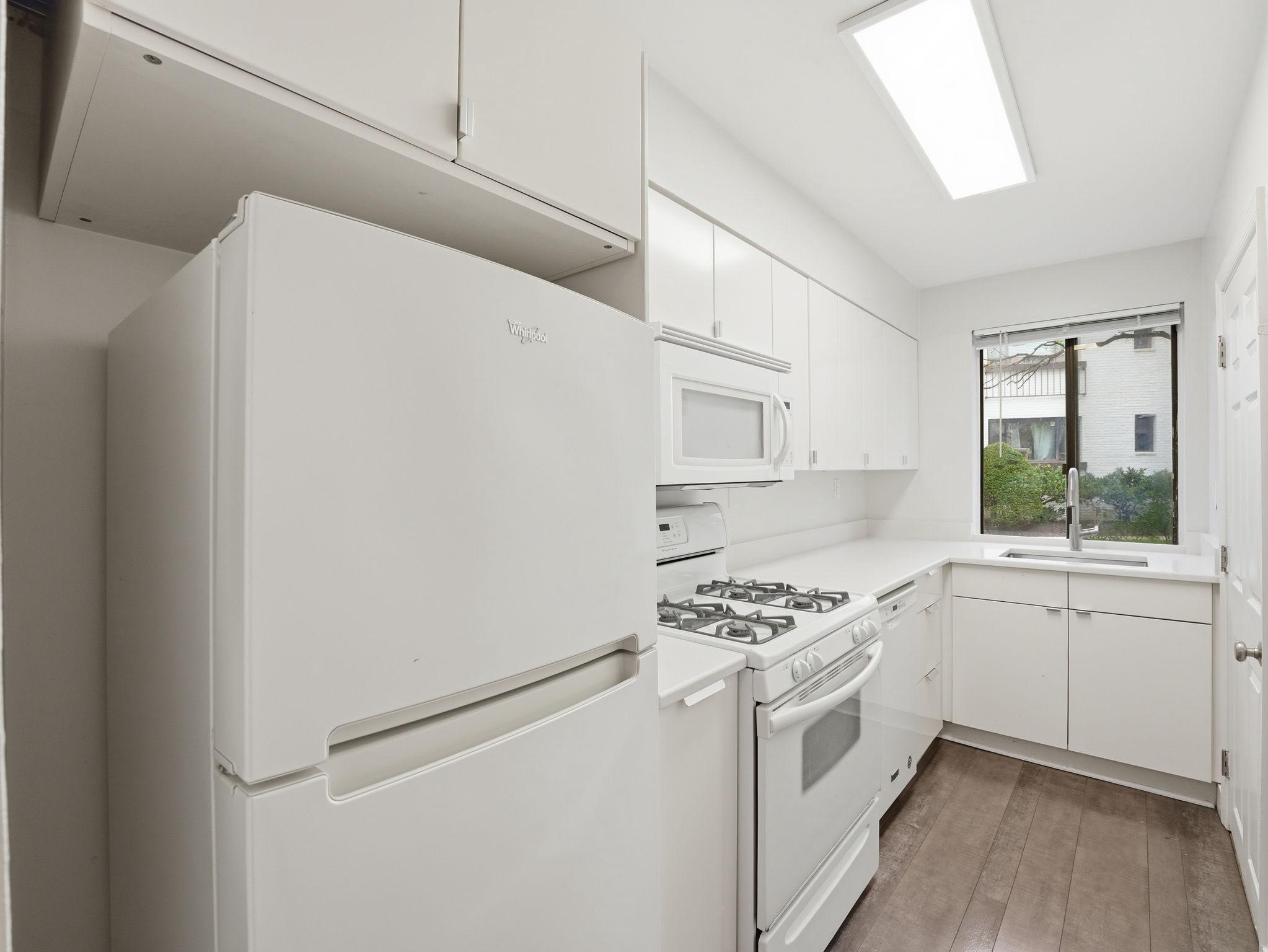 3835 Davis Place Northwest, Unit 2 Washington, DC 20007 - Photo 10 of 29 Updated galley kitchen with gas cooking.