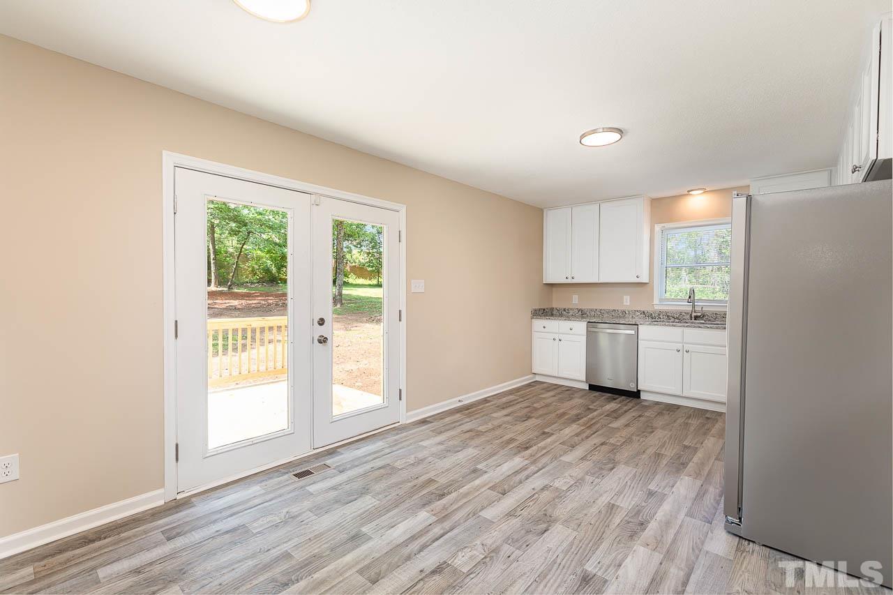 2016 Fox Ridge Road Clayton, NC 27527 - Photo 17 of 30 a view of a kitchen with wooden floor and a sink