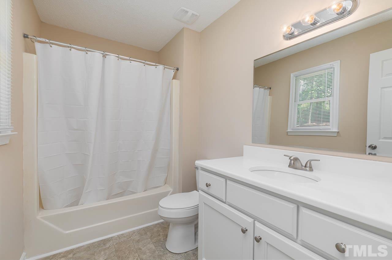 2016 Fox Ridge Road Clayton, NC 27527 - Photo 28 of 30 a bathroom with a sink toilet and shower