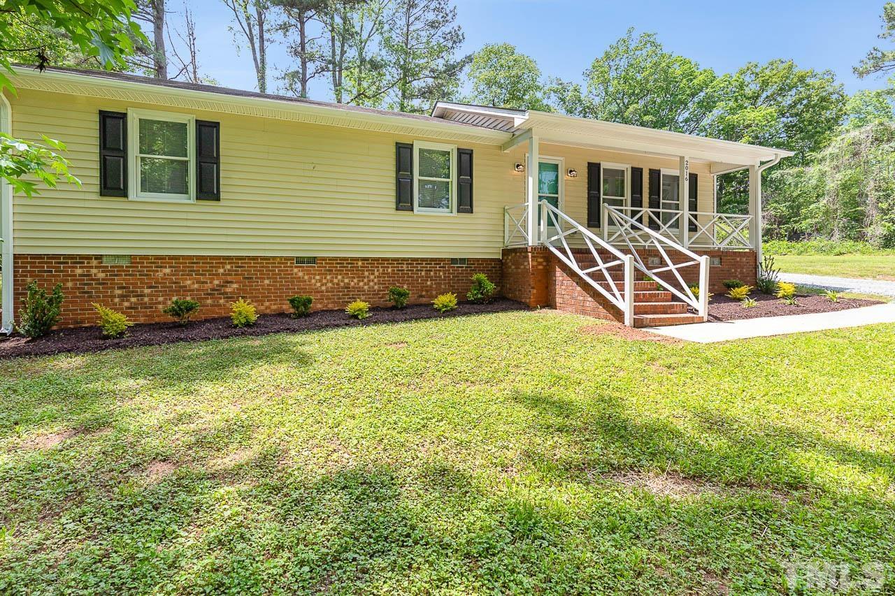 2016 Fox Ridge Road Clayton, NC 27527 - Photo 3 of 30 a view of a house with backyard porch and sitting area