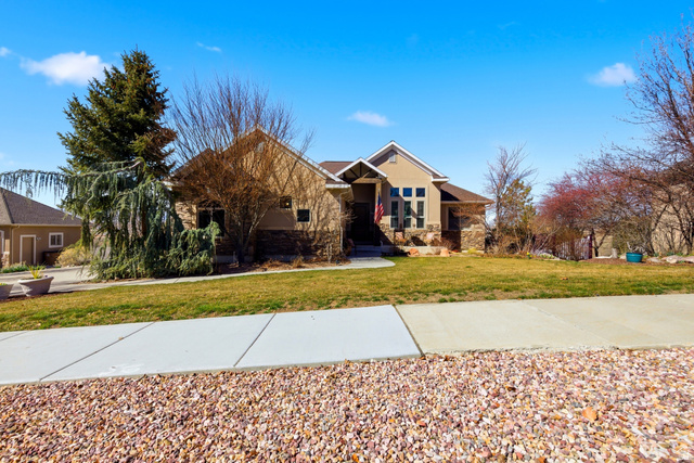 722 West Webb Circle Draper, UT 84020 - Photo 1 of 1 Craftsman inspired home featuring stone siding and a front lawn
