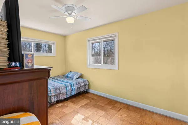 a bedroom with bed and a window