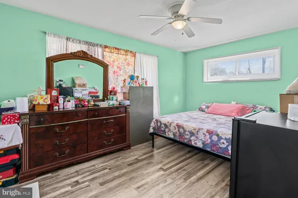 a bedroom with a bed and a dresser