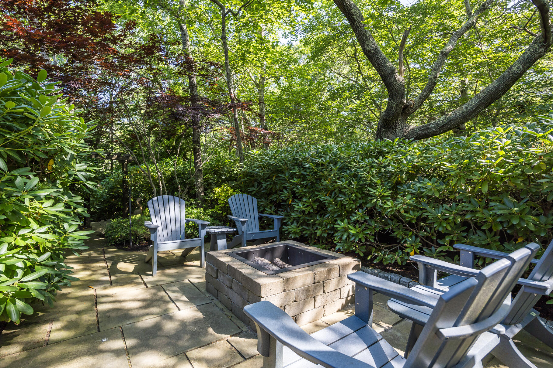 12 Somerset Road Provincetown, MA 02657 - Photo 35 of 38 a roof deck with table and chairs a barbeque with potted plants and large trees