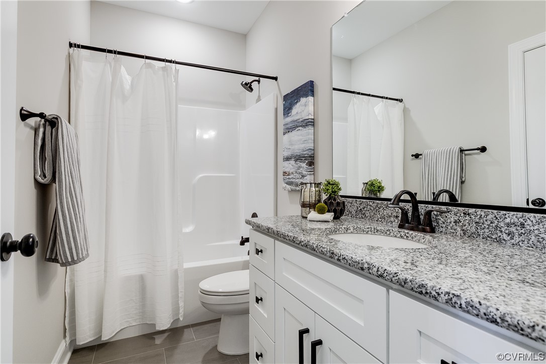 1504 Decatur Street Richmond, VA 23224 - Photo 12 of 37 a bathroom with a granite countertop sink a toilet and shower