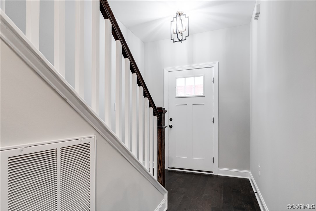 1504 Decatur Street Richmond, VA 23224 - Photo 8 of 37 a view of a hallway with wooden floor and staircase