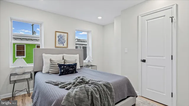 a bed room with a bed and a window