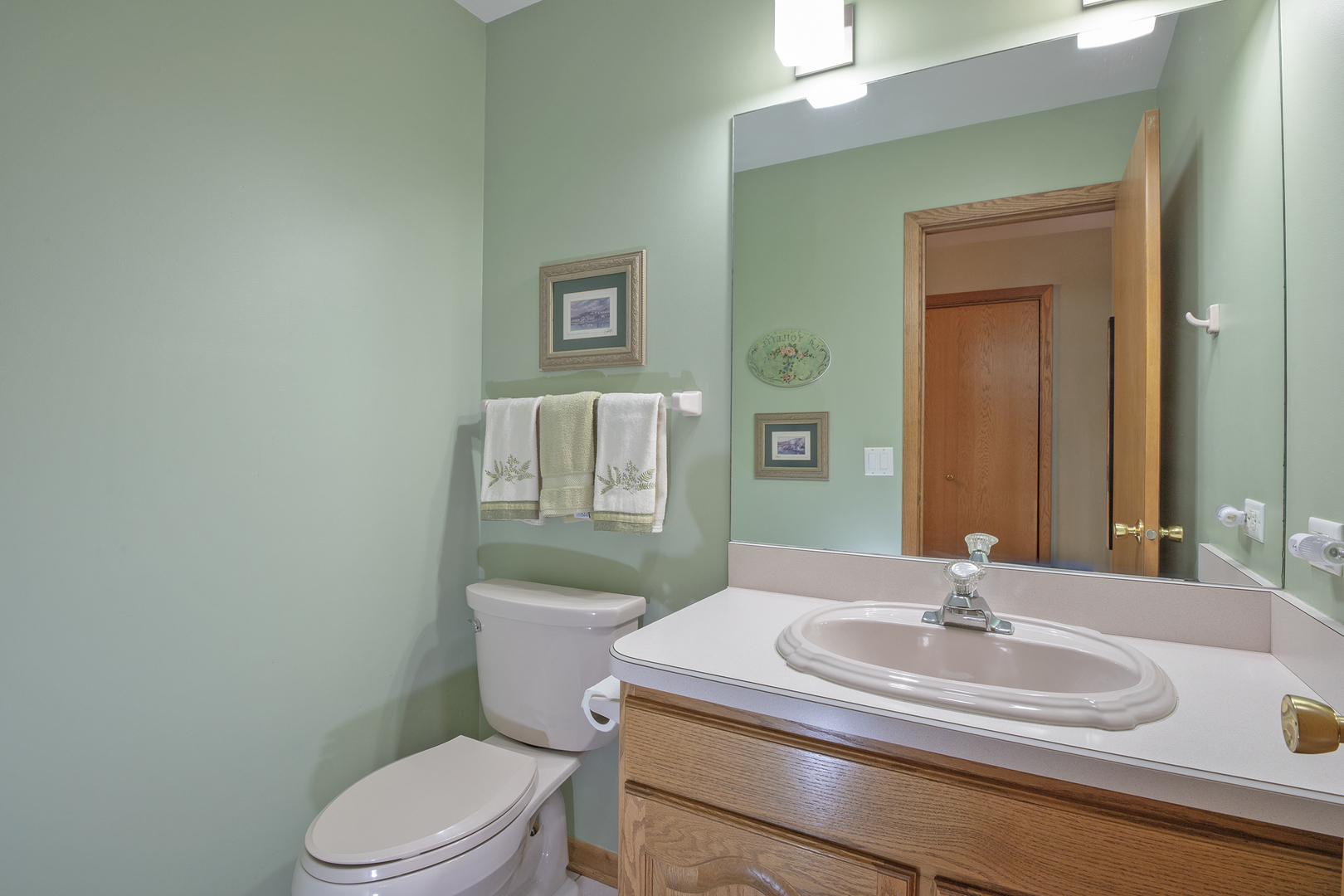 809 Tide Court Wheeling, IL 60090 - Photo 12 of 21 a bathroom with a granite countertop toilet sink and mirror