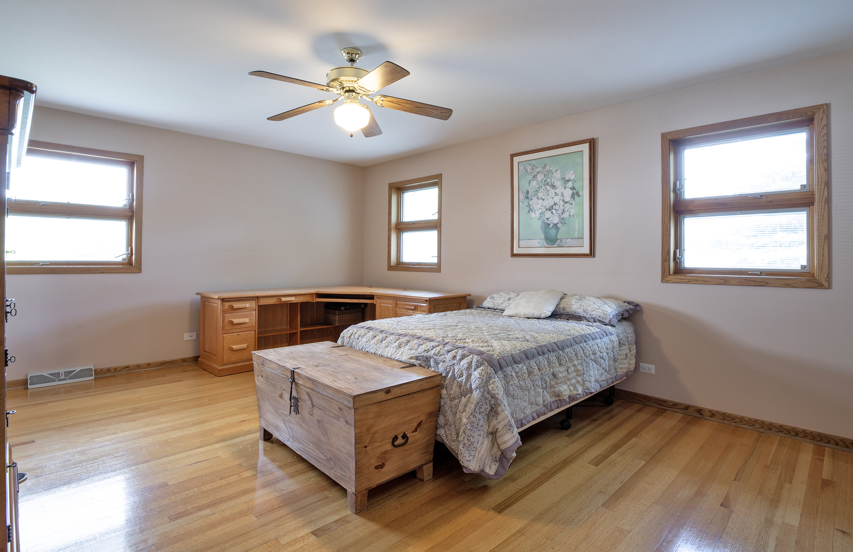 809 Tide Court Wheeling, IL 60090 - Photo 13 of 21 a spacious bedroom with a bed and a chandelier