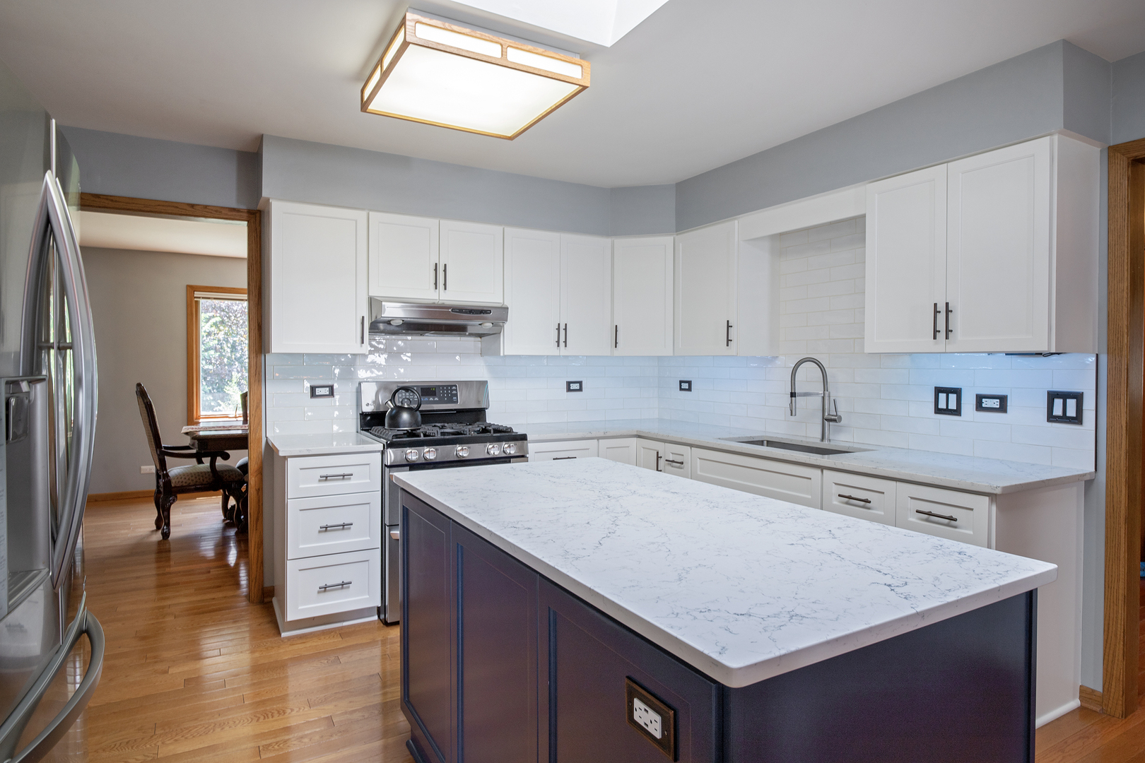 809 Tide Court Wheeling, IL 60090 - Photo 6 of 21 a kitchen with a stove a sink and a refrigerator