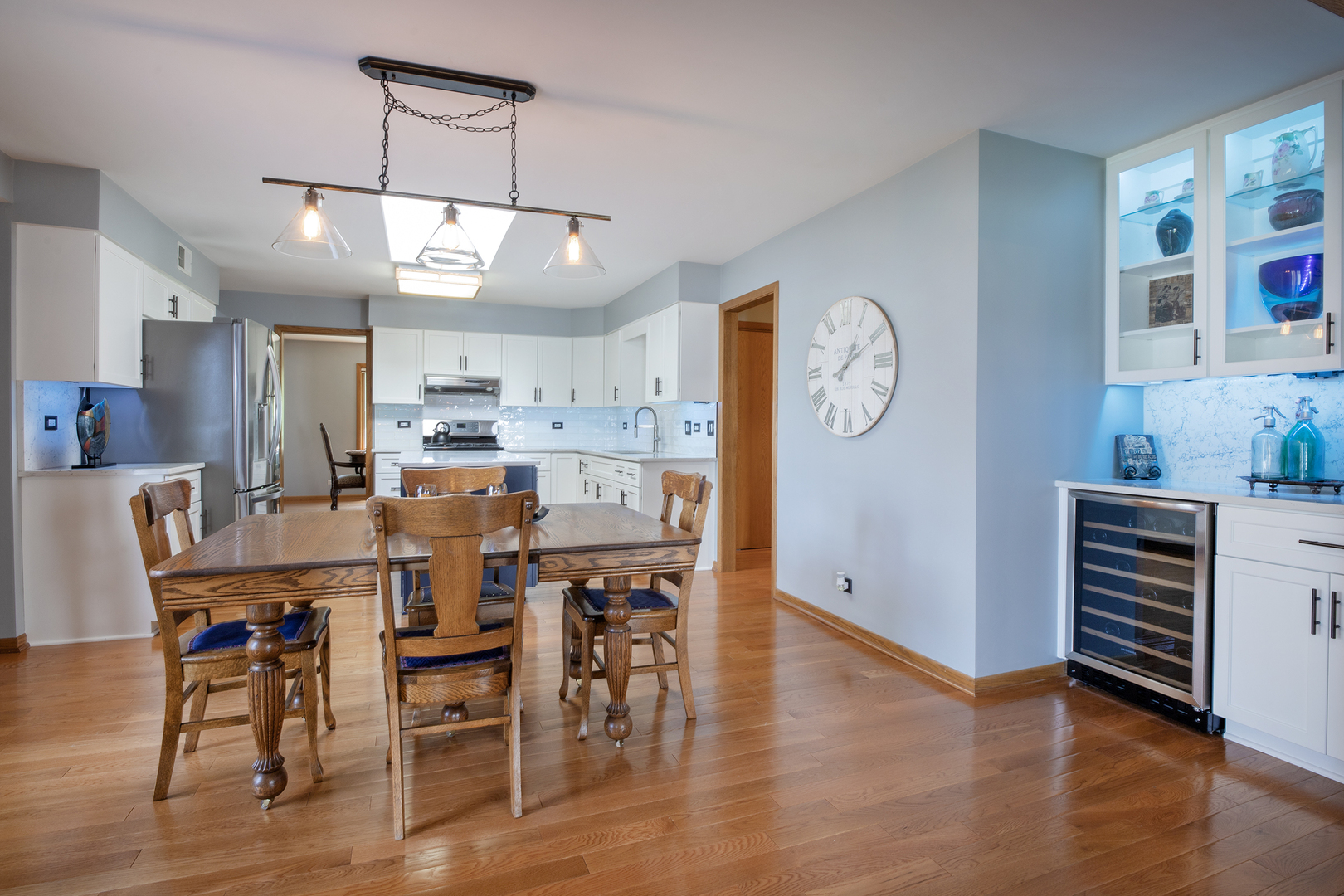 809 Tide Court Wheeling, IL 60090 - Photo 7 of 21 a view of a dining room with furniture window and wooden floor