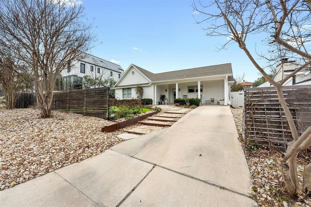 2802 Warren Street, Unit A Austin, TX 78703 - Photo 28 of 29 a view of a house with a yard covered in snow