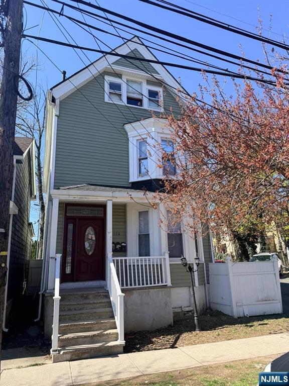 318 White Street Orange, NJ 07050 - Photo 1 of 8 a front view of a house with a yard