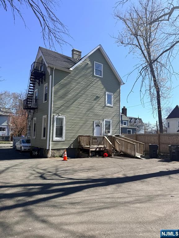 318 White Street Orange, NJ 07050 - Photo 6 of 8 a view of a house with a yard