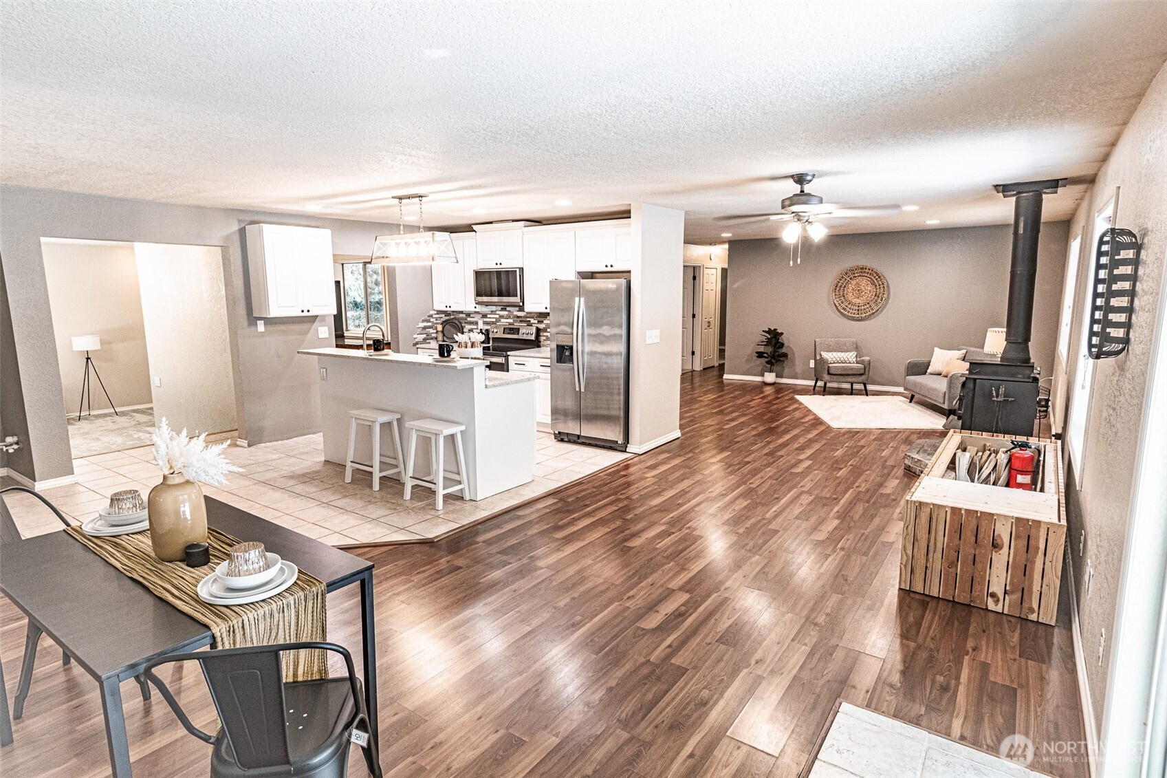 660 Peter Hagen Road West Seabeck, WA 98380 - Photo 16 of 39 a large kitchen with a table and chairs