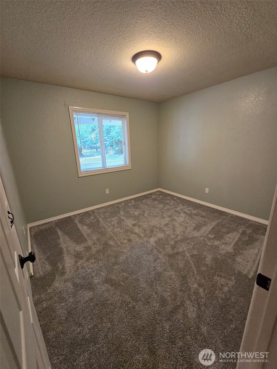 660 Peter Hagen Road West Seabeck, WA 98380 - Photo 23 of 39 a view of an empty room with a window