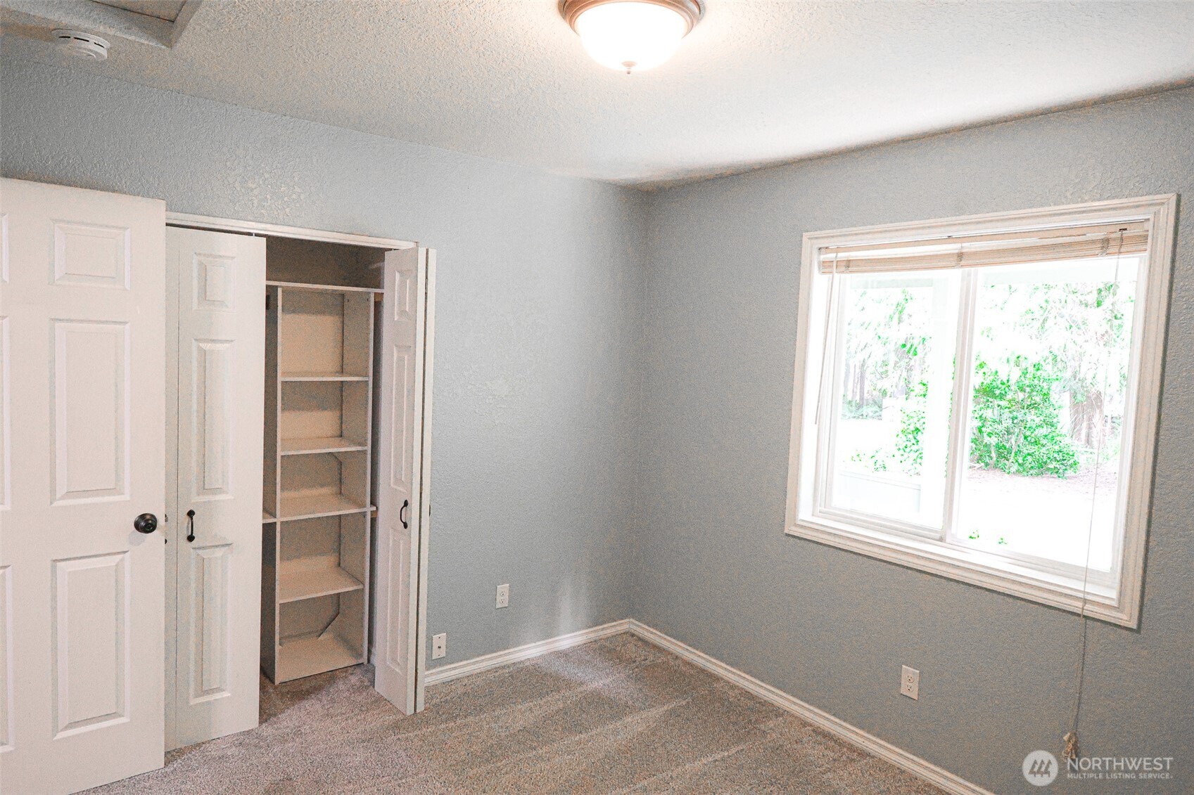 660 Peter Hagen Road West Seabeck, WA 98380 - Photo 25 of 39 a view of an empty room with closet and a window