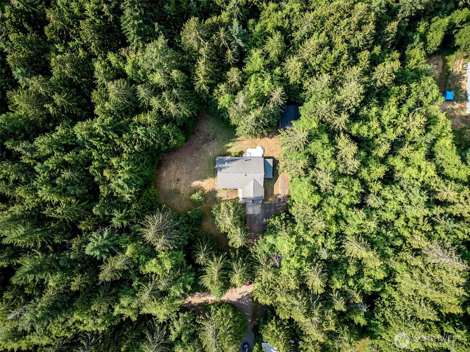 660 Peter Hagen Road West Seabeck, WA 98380 - Photo 5 of 39 an aerial view of a house with a yard