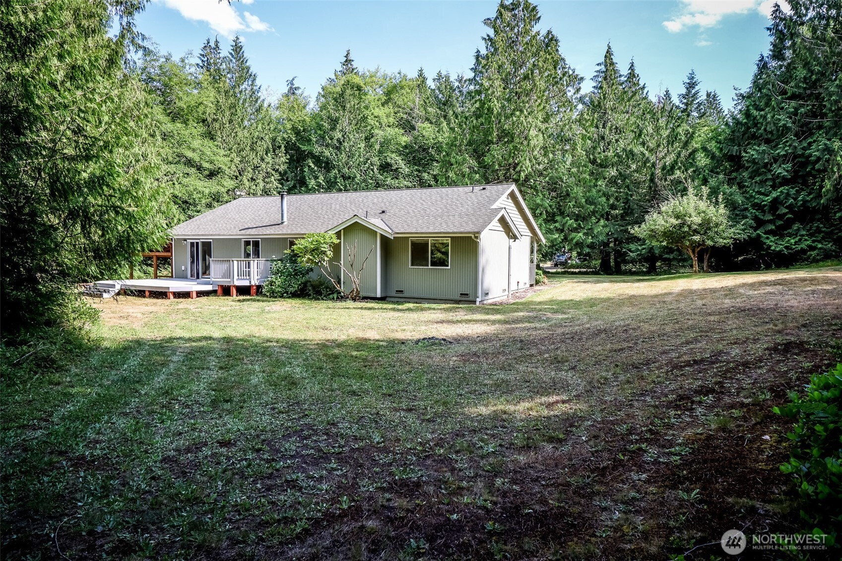 660 Peter Hagen Road West Seabeck, WA 98380 - Photo 7 of 39 a front view of a house with a yard