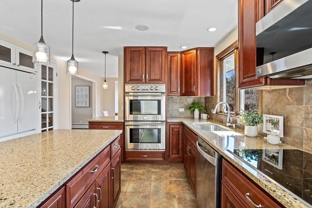 62 Westcott Road Harvard, MA 01451 - Photo 11 of 42 a kitchen with stainless steel appliances granite countertop a sink a stove and a refrigerator