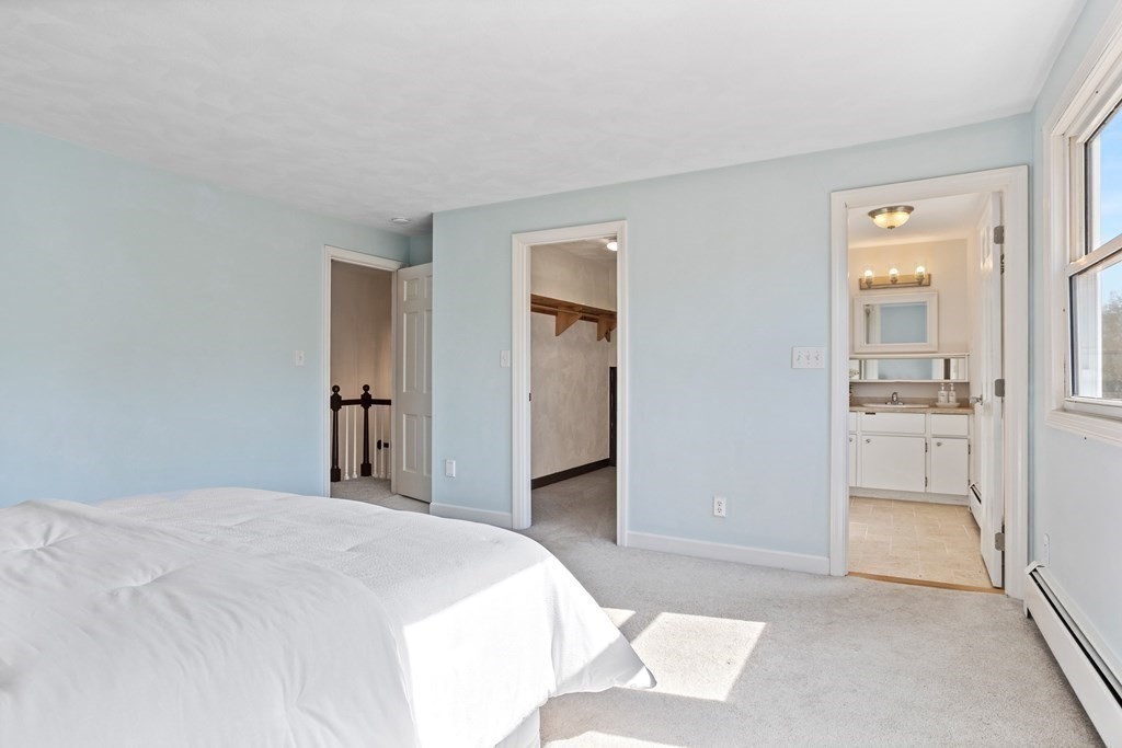 62 Westcott Road Harvard, MA 01451 - Photo 21 of 42 a bedroom with a bed and a view of bathroom