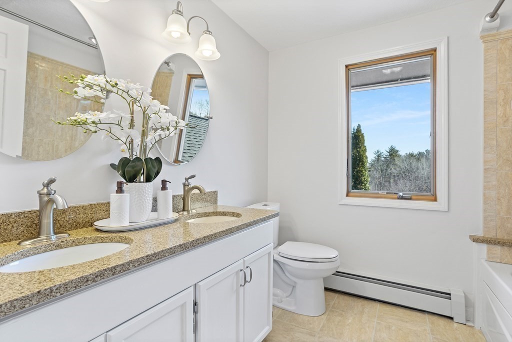 62 Westcott Road Harvard, MA 01451 - Photo 23 of 42 a bathroom with a toilet sink and mirror