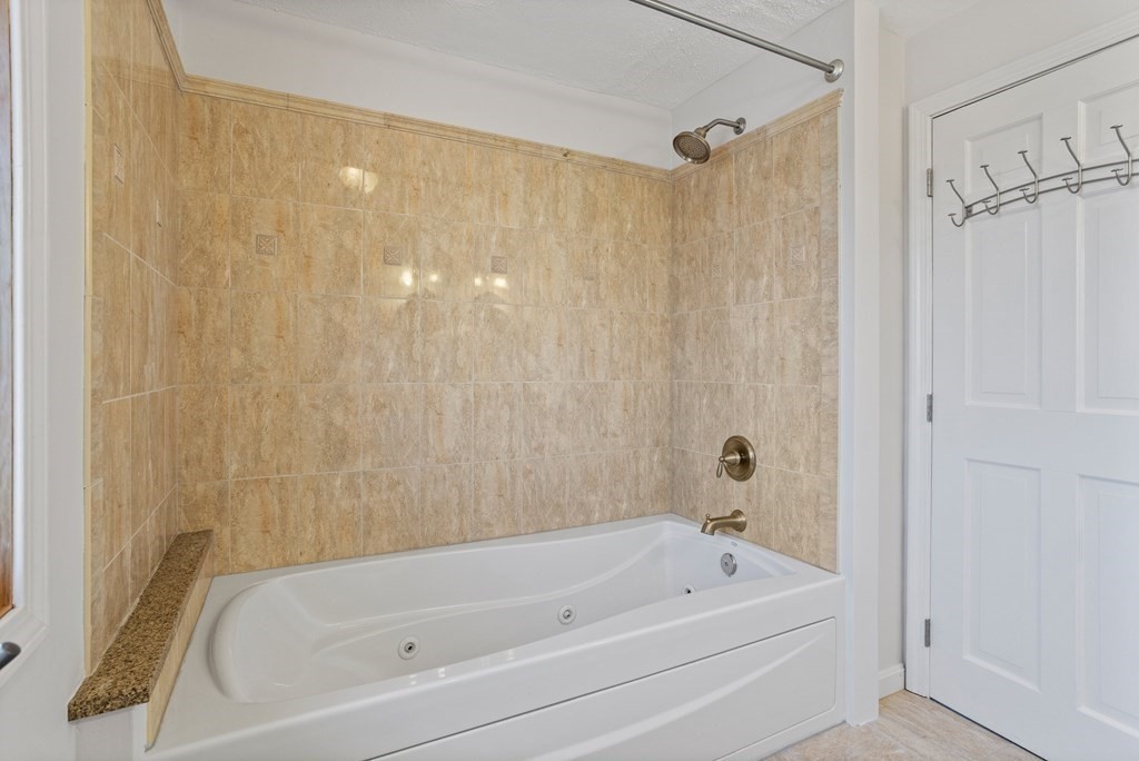 62 Westcott Road Harvard, MA 01451 - Photo 24 of 42 a bathroom with a tub a sink and a shower