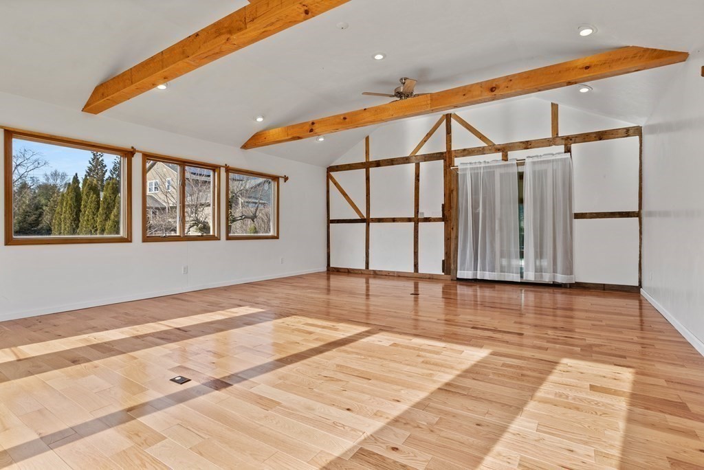 62 Westcott Road Harvard, MA 01451 - Photo 35 of 42 a view of an empty room with wooden floor and windows