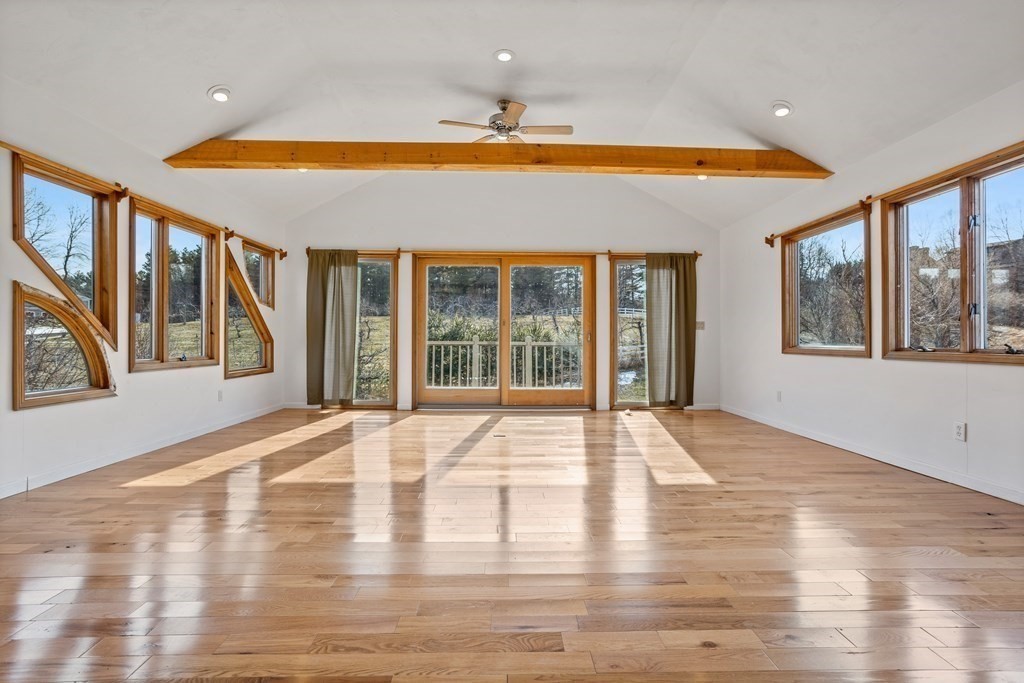 62 Westcott Road Harvard, MA 01451 - Photo 36 of 42 a view of an empty room with wooden floor and a window