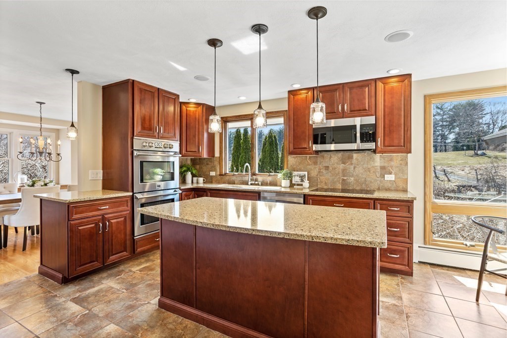 62 Westcott Road Harvard, MA 01451 - Photo 10 of 42 a large kitchen with kitchen island a large window in it
