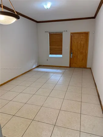 a view of an empty room with windows