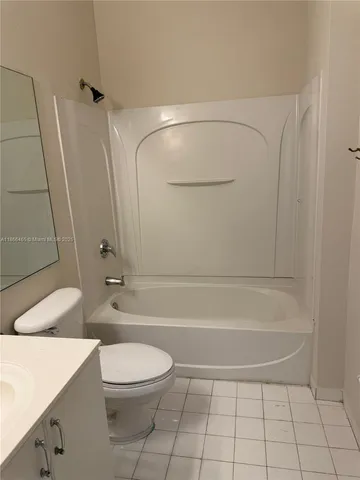 a bathroom with a toilet a sink and shower