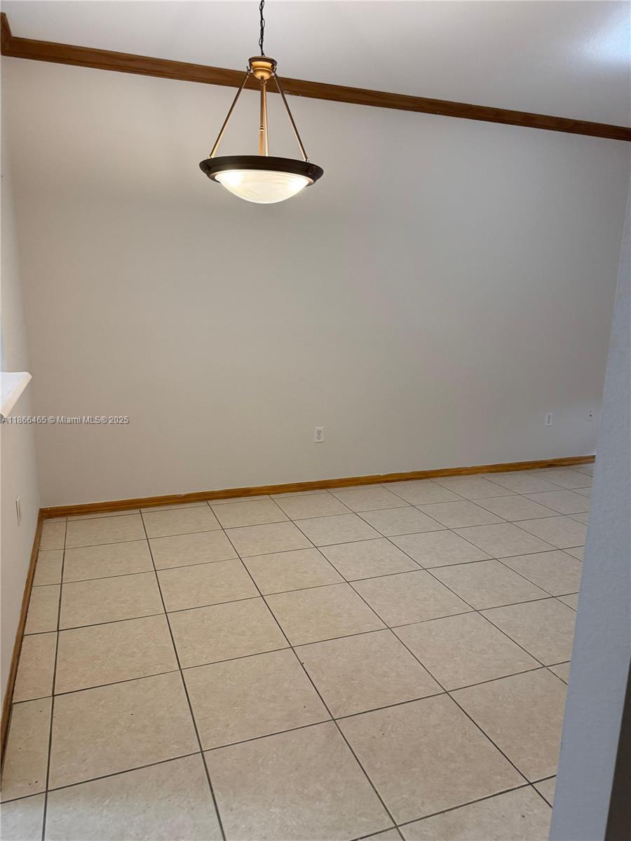 6922 Northwest 179th Street, Unit 1035 Hialeah, FL 33015 - Photo 10 of 14 a view of a refrigerator in a kitchen