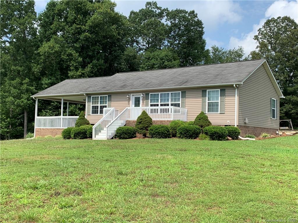 1650 Maple Creek Road Rutherfordton, NC 28139 - Photo 1 of 7 a view of a house next to a yard with plants and trees