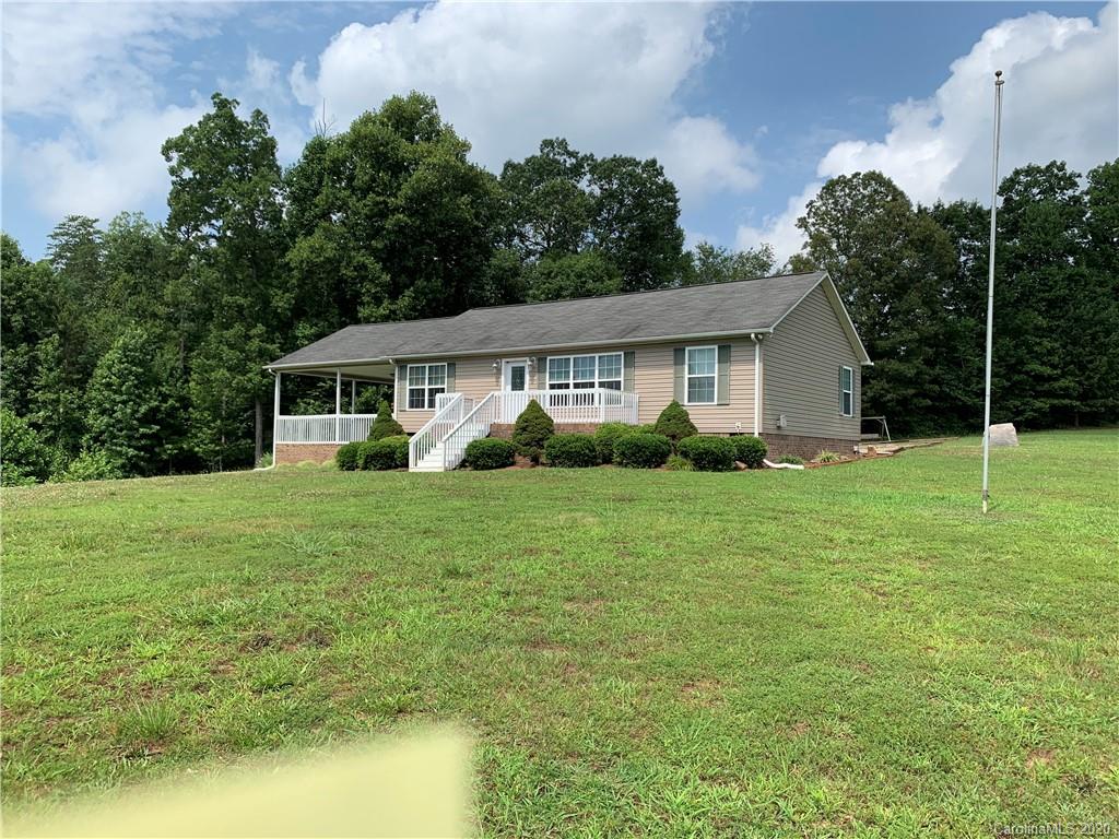 1650 Maple Creek Road Rutherfordton, NC 28139 - Photo 3 of 7 a view of a house with backyard sitting area and garden