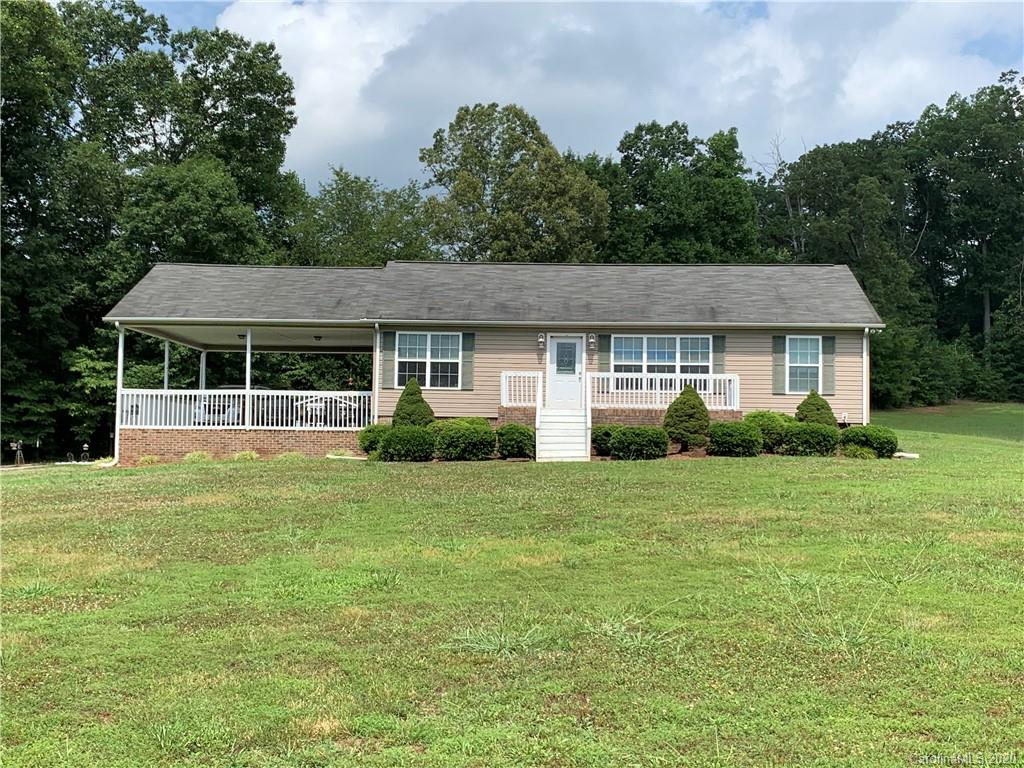 1650 Maple Creek Road Rutherfordton, NC 28139 - Photo 4 of 7 a front view of a house with a garden