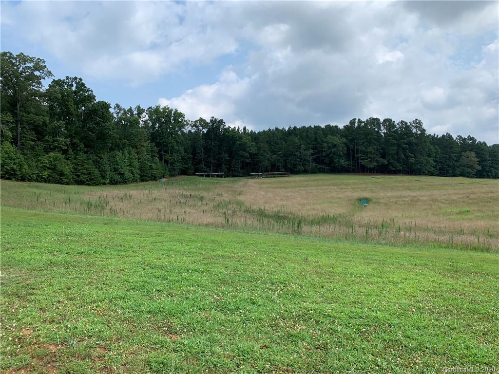 1650 Maple Creek Road Rutherfordton, NC 28139 - Photo 7 of 7 a view of a field with an trees in the background