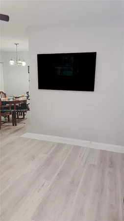 a view of an empty room with furniture