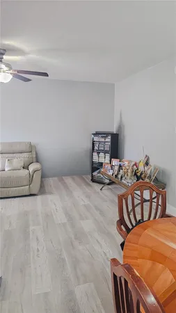 a bedroom with furniture and a chair