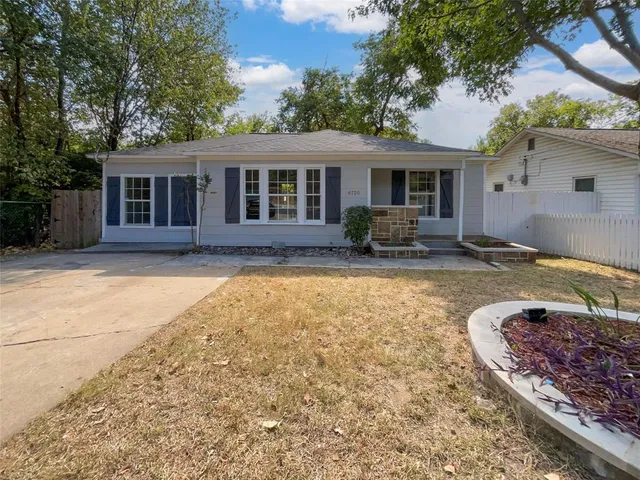 a front view of house with yard outdoor seating and barbeque oven