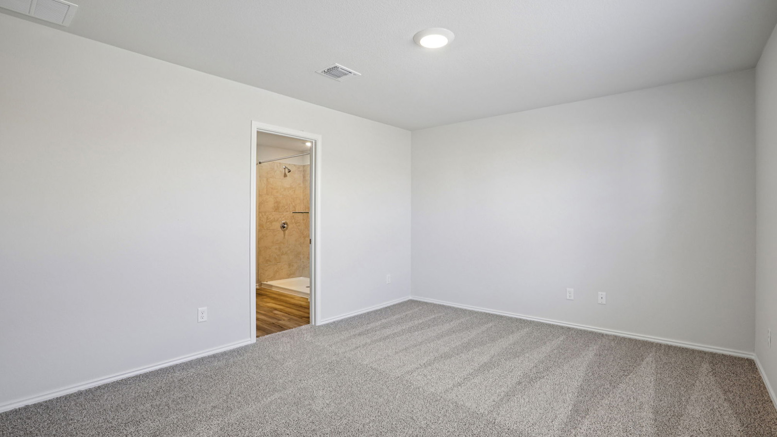 156 Wyatt Way Jarrell, TX 76537 - Photo 18 of 30 Spacious room with plush gray carpeting and recessed lighting