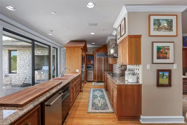 a view of a hallway with furniture and window