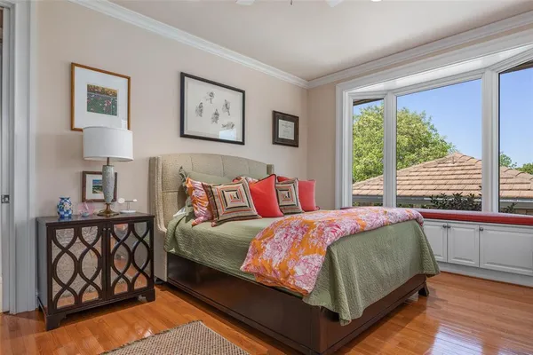 a bedroom with a bed and window