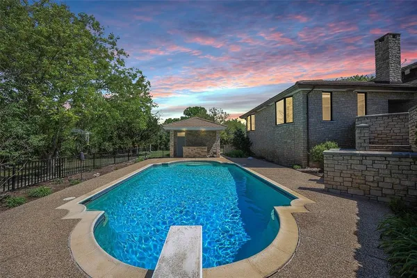 a view of a house with swimming pool